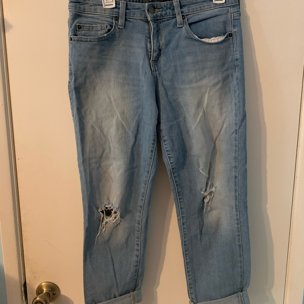 Mid rise distressed “boyfriend” jeans